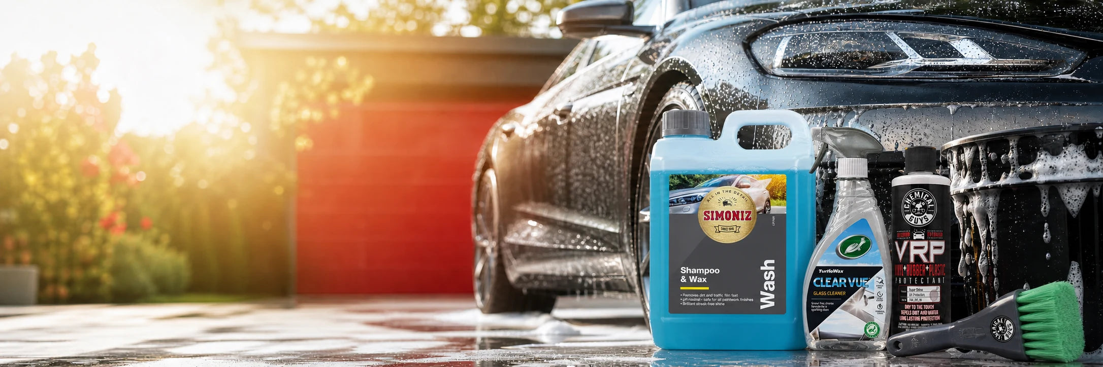 Simoniz, Turtle Wax and Chemical Guys summer car cleaning products beside a freshly washed car